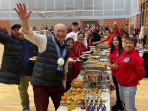 Large group enjoying a festive buffet.