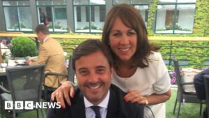Couple smiling outdoors; BBC News.